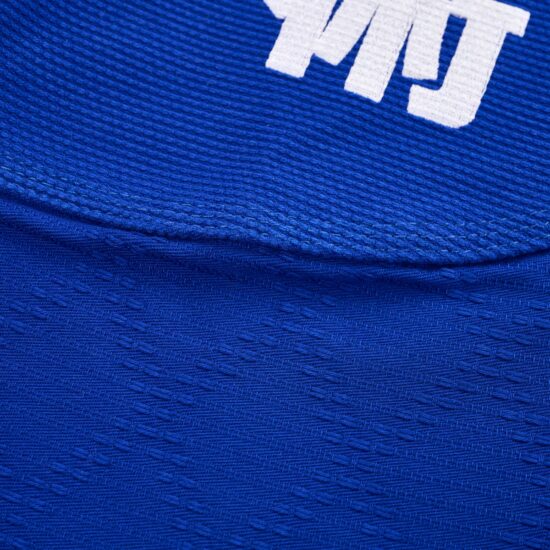 Detail of the white logo and shoulder seam on the ATHOM Shohei blue BJJ gi