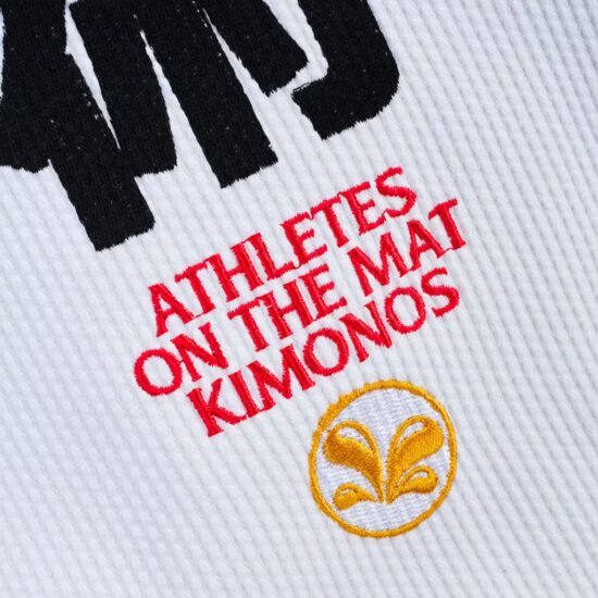 Close-up of the Athletes on the Mat Kimonos embroidery on pearl weave fabric