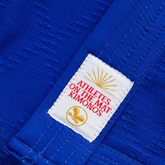 Athletes on the Mat Kimonos label stitched on the Shohei blue gi